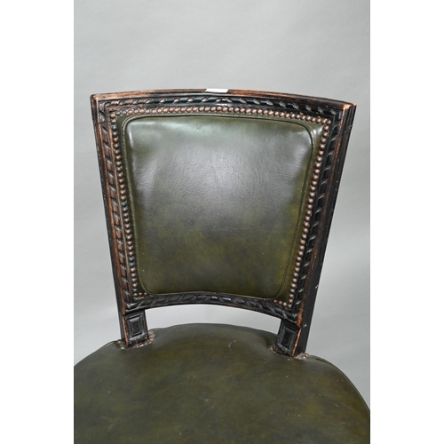 912 - A pair of antique French Empire green studded leather side chairs, with moulded ebonised walnut fram... 