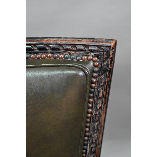 912 - A pair of antique French Empire green studded leather side chairs, with moulded ebonised walnut fram... 