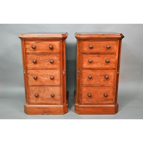 915 - A pair of Victorian mahogany four drawer pedestals, with twin turned knobs and canted corners, 46 cm... 