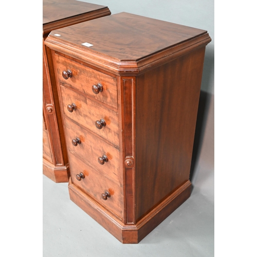 915 - A pair of Victorian mahogany four drawer pedestals, with twin turned knobs and canted corners, 46 cm... 