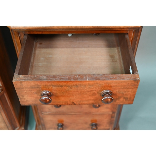 915 - A pair of Victorian mahogany four drawer pedestals, with twin turned knobs and canted corners, 46 cm... 