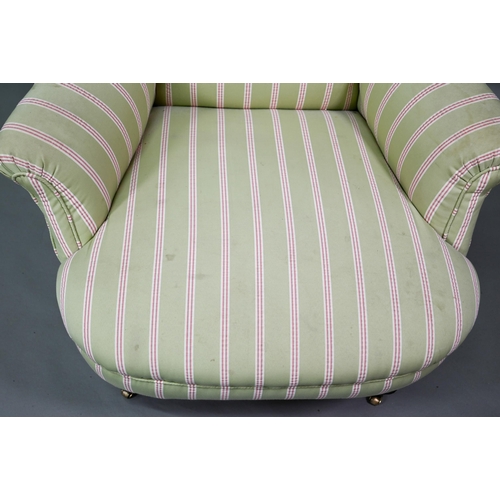 917 - A late Victorian armchair, well re-upholstered in striped pale green/red fabric, raised on castors