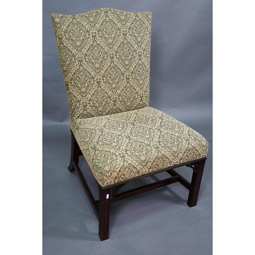 918 - An old hump back Gainsborough elbow chair, re-upholstered in green fabric and raised on moulded squa... 