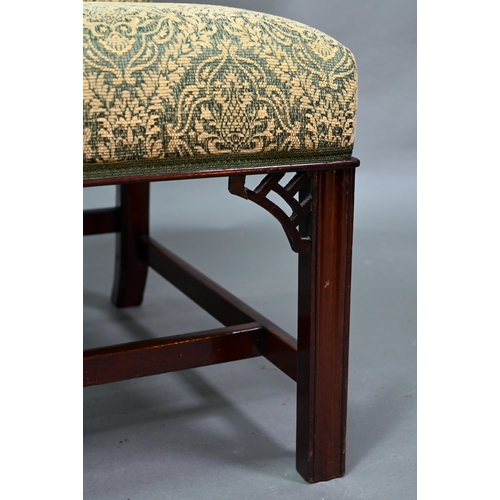 918 - An old hump back Gainsborough elbow chair, re-upholstered in green fabric and raised on moulded squa... 