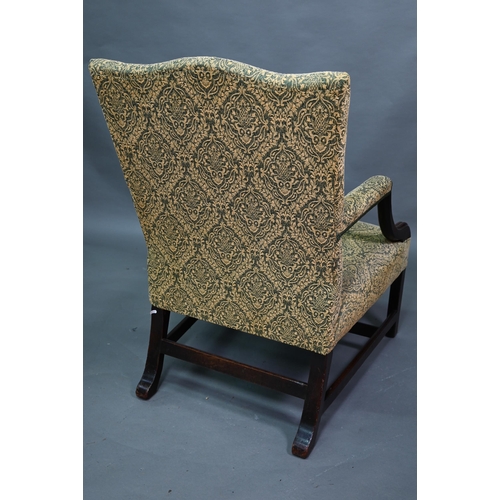 918 - An old hump back Gainsborough elbow chair, re-upholstered in green fabric and raised on moulded squa... 