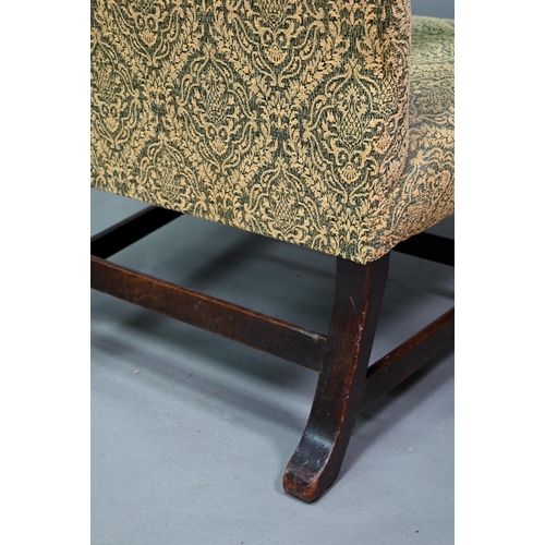 918 - An old hump back Gainsborough elbow chair, re-upholstered in green fabric and raised on moulded squa... 