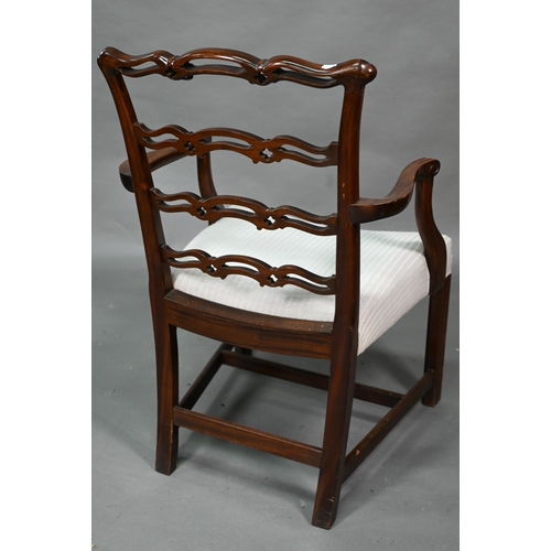 919 - A set of eight Georgian style walnut dining chairs with pierced wavy splats over overstuffed seats o... 