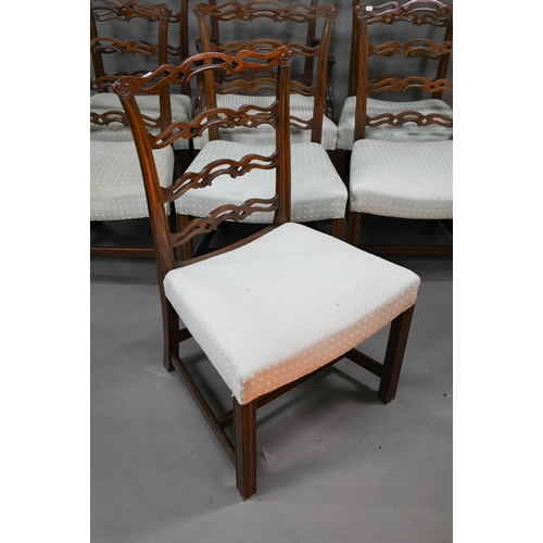 919 - A set of eight Georgian style walnut dining chairs with pierced wavy splats over overstuffed seats o... 