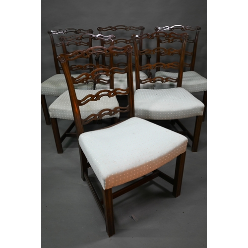 919 - A set of eight Georgian style walnut dining chairs with pierced wavy splats over overstuffed seats o... 