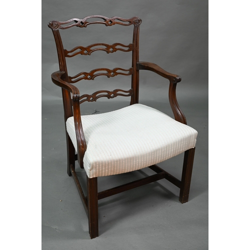 919 - A set of eight Georgian style walnut dining chairs with pierced wavy splats over overstuffed seats o... 