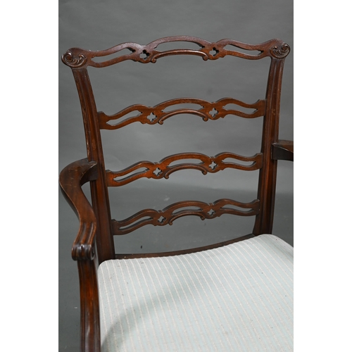 919 - A set of eight Georgian style walnut dining chairs with pierced wavy splats over overstuffed seats o... 