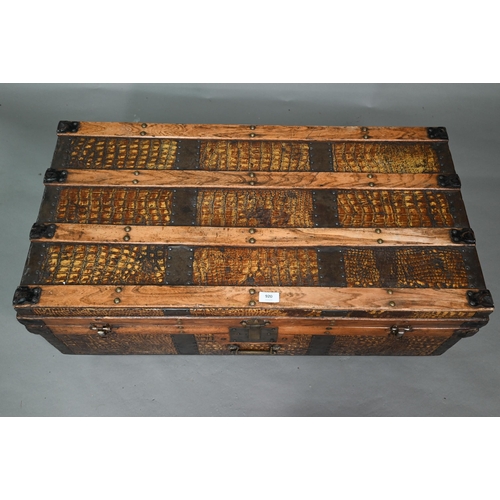 920 - A vintage steel and wood bound crocodile skin panelled trunk, with leather carrying handles, 92 cm w... 