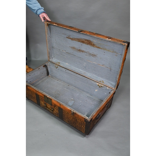 920 - A vintage steel and wood bound crocodile skin panelled trunk, with leather carrying handles, 92 cm w... 