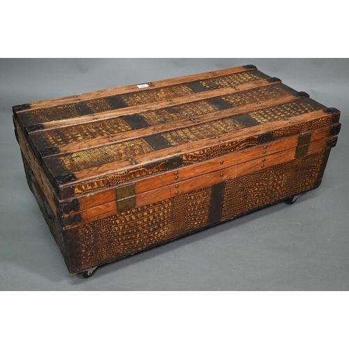 920 - A vintage steel and wood bound crocodile skin panelled trunk, with leather carrying handles, 92 cm w... 