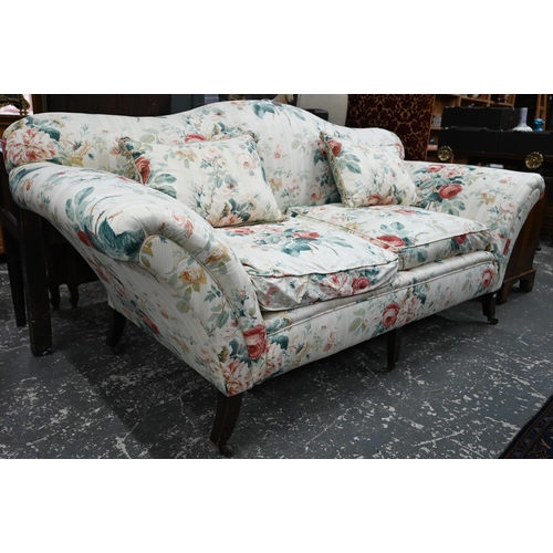 921 - A Georgian style hump back scroll arm sofa, in floral Colefax & Fowler fabric, raised on three f... 