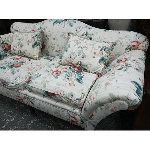 921 - A Georgian style hump back scroll arm sofa, in floral Colefax & Fowler fabric, raised on three f... 