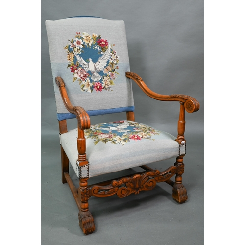 923 - A continental moulded walnut framed blue embroidered dove design panelled open armchair