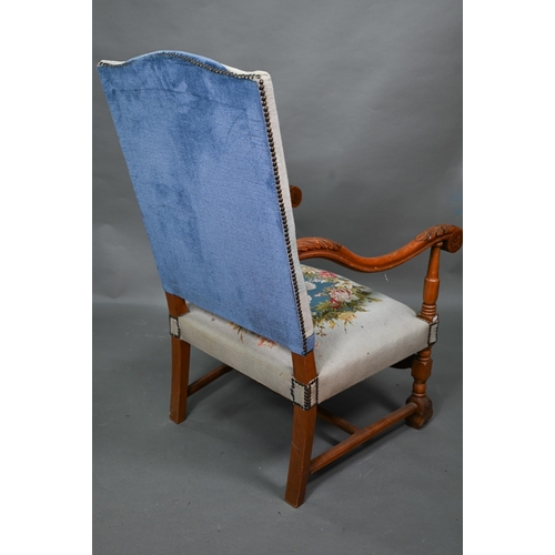 923 - A continental moulded walnut framed blue embroidered dove design panelled open armchair