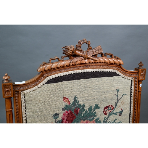 925 - A continental carved limewood fire-screen, with tapestry panel, 67 cm w x 107 cm h