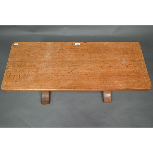 928 - Robert 'Mouseman' Thompson, Kilburn, an oak coffee table, the rectangular adzed top raised on two oc... 