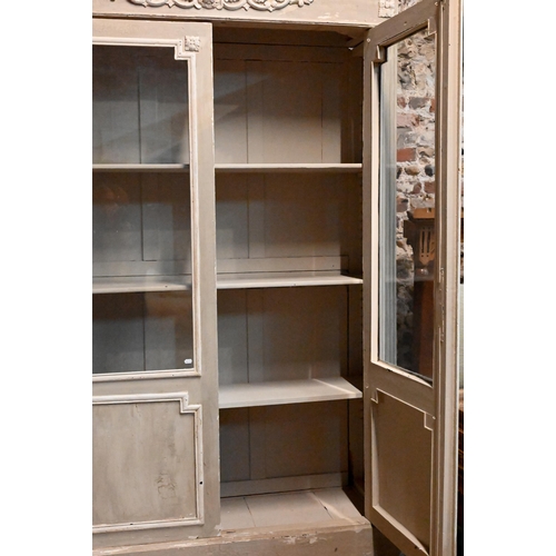 937 - A continental part glazed distressed painted cabinet, raised on bun feet, 140 cm w x 41 cm x 216 cm ... 