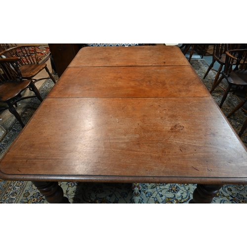 944 - An early Victorian mahogany draw leaf dining table, with single insert leaf, the top with moulded ed... 