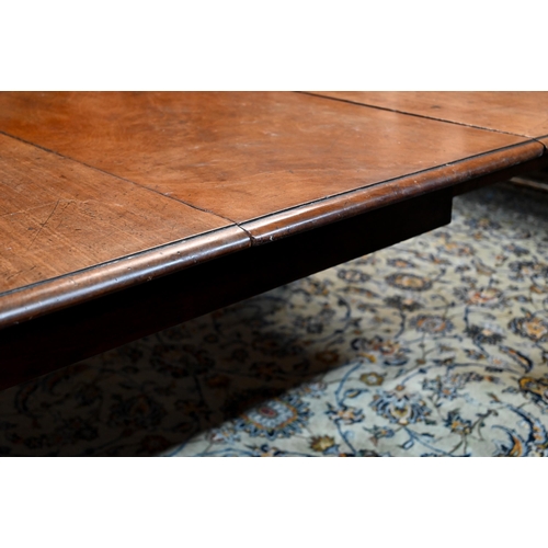 944 - An early Victorian mahogany draw leaf dining table, with single insert leaf, the top with moulded ed... 