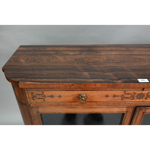 945 - A Regency brass inlaid rosewood side cabinet, the full width frieze drawer over a pair of glazed-in ... 