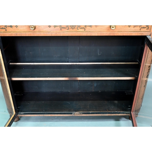 945 - A Regency brass inlaid rosewood side cabinet, the full width frieze drawer over a pair of glazed-in ... 