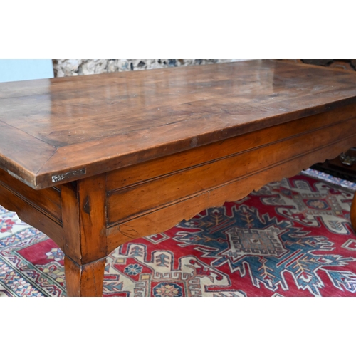 947 - A French fruitwood table, 19th century, the mitre framed rectangular top sliding to reveal a deep st... 