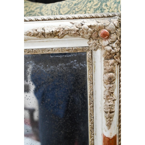 955 - An Italian cream painted and gesso wall mirror, the plate speckled with age, 60 cm h x 46 cm w