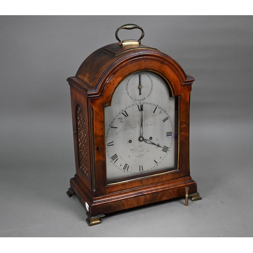 Vigne & Lautier, Bath, a George III mahogany dome cased bracket clock, the 8-day movement striking the hours on a bell with signed backplate, the arched silvered dial with roman numerals and subsidiary strike/silent, the case with brass carrying handle, pierced brass fish scale side panels and raised on brass bracket feet, 43 cm h o/all