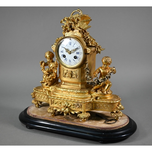 970 - A late 19th century gilt ormolu cherub mounted mantel clock with twin train eight day movement by Ma... 