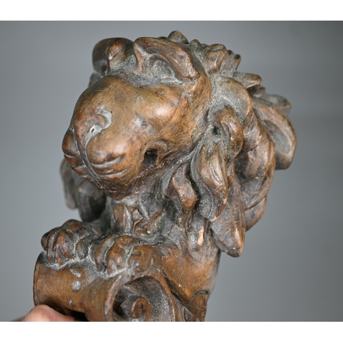 977 - A pair of 19th century Continental carved wood furniture brackets, worked with lions, 33 cm high