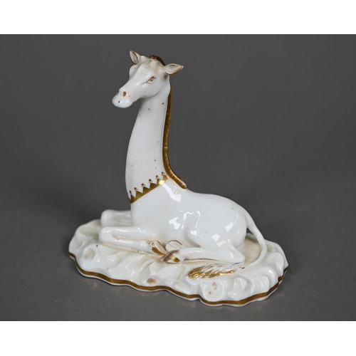 599A - A Victorian china seated giraffe, in the manner of Grainger's Worcester, on naturalistic base, 11.5 ... 