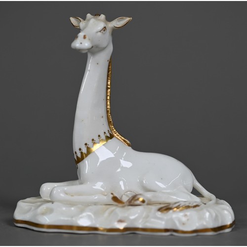 599A - A Victorian china seated giraffe, in the manner of Grainger's Worcester, on naturalistic base, 11.5 ... 