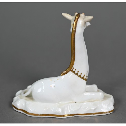 599A - A Victorian china seated giraffe, in the manner of Grainger's Worcester, on naturalistic base, 11.5 ... 