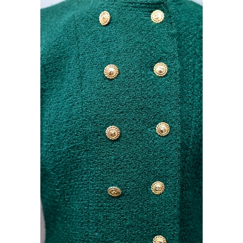 1280 - Chanel Boutique - A green wool jacket, double-breasted and fitted with six rows of double gilt-metal... 