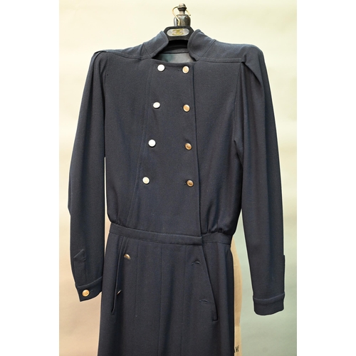 1281 - Chanel - A navy crepe dress, with long sleeves, stand-up collar and six rows of gilt metal buttons, ... 