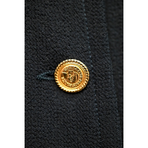 1281 - Chanel - A navy crepe dress, with long sleeves, stand-up collar and six rows of gilt metal buttons, ... 