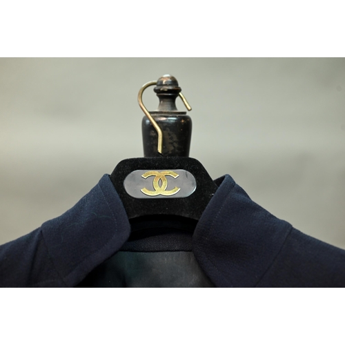 1281 - Chanel - A navy crepe dress, with long sleeves, stand-up collar and six rows of gilt metal buttons, ... 