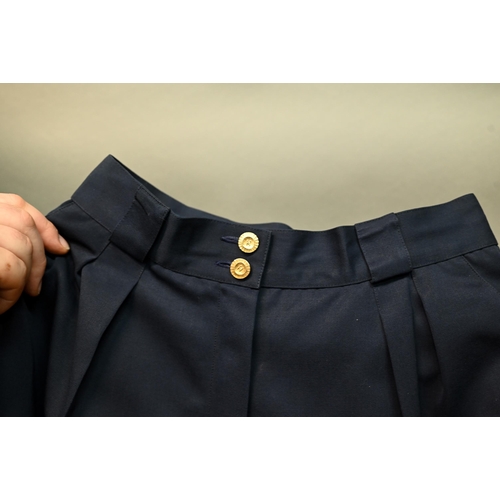 1282 - Chanel - A pair of navy trousers, with pleated front and gilt metal button detailing, fully lined, s... 