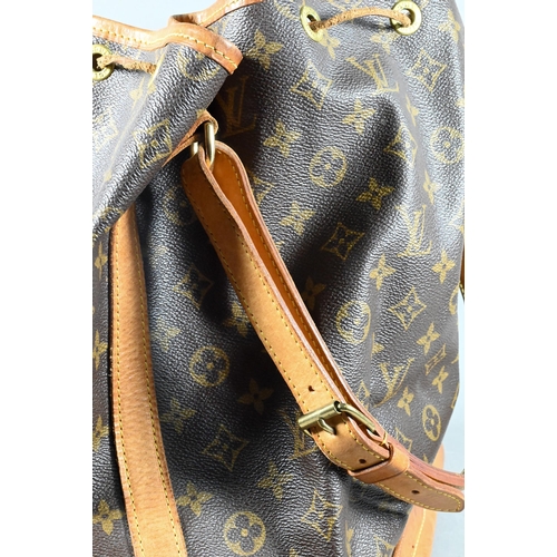 1283 - Louis Vuitton - A duffle bag with drawstring and single strap handle c/w dust bag