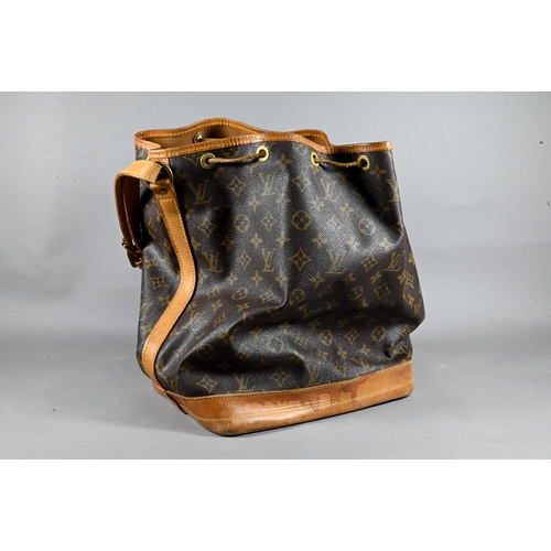 1283 - Louis Vuitton - A duffle bag with drawstring and single strap handle c/w dust bag