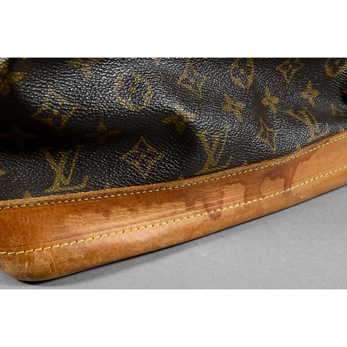 1283 - Louis Vuitton - A duffle bag with drawstring and single strap handle c/w dust bag