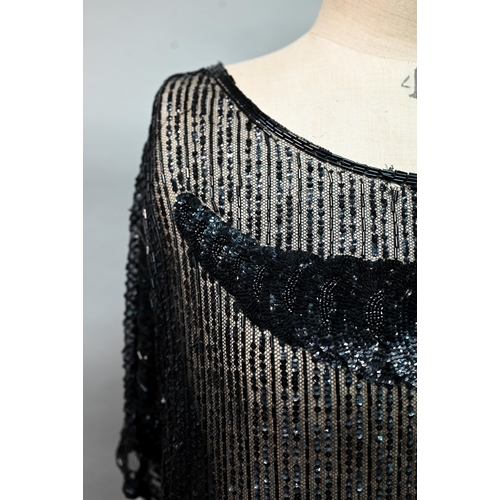 1287 - Two 1920s black 'flapper' dresses, heavily beaded and embellished on fine net, one with beaded cord ... 