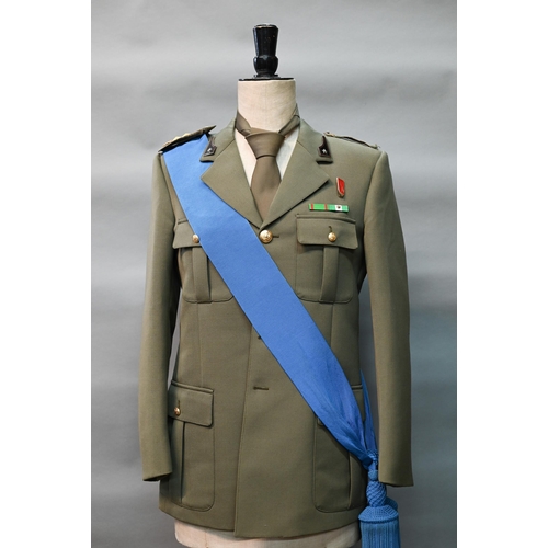 1288 - An Italian military uniform comprising dress tunic, trousers, tie and blue sash, to/w two pairs of r... 