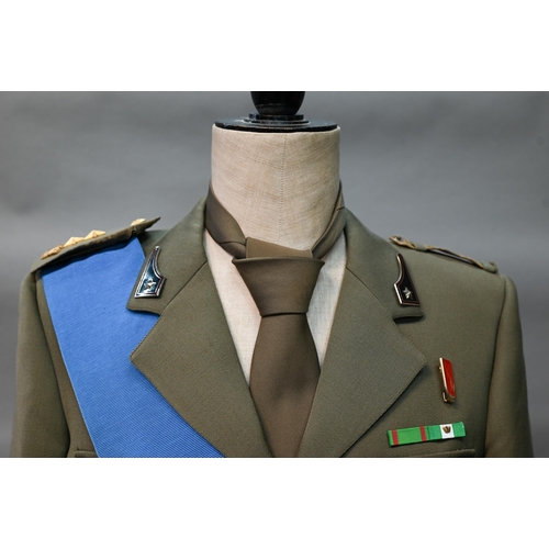 1288 - An Italian military uniform comprising dress tunic, trousers, tie and blue sash, to/w two pairs of r... 