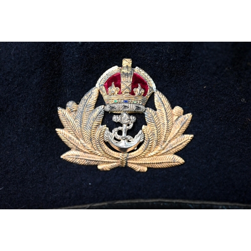 1289 - A Royal Navy boat cloak, beret and sword belt with King's crown on belt and  Lt Cdr epaulettes, by G... 