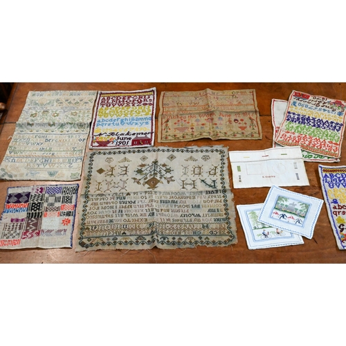 1297 - Two boxes of mixed textiles including table linens, two chintz patchwork coverlets, etc